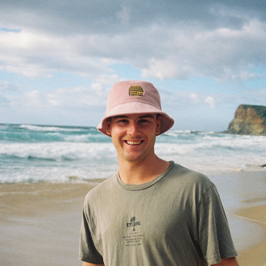 Corduroy bucket hat in salmon pink colour.